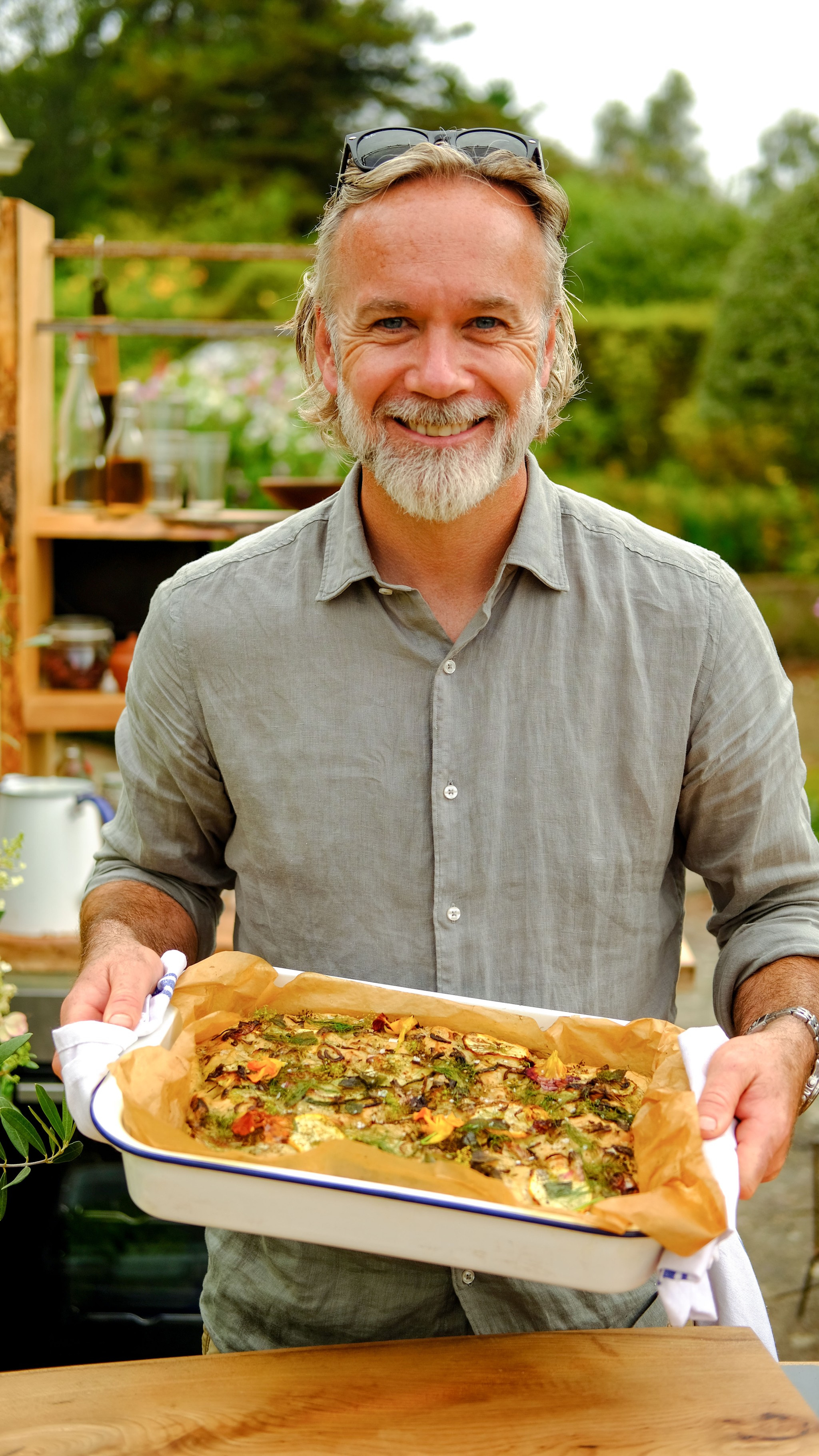 Marcus Wareing holds a herb focaccia on Tales from a Kitchen Garden