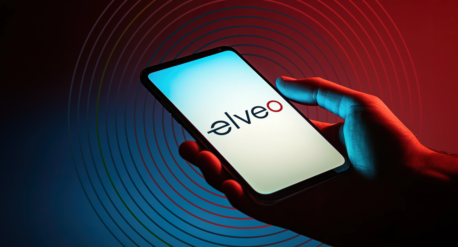 Hand holding a smartphone displaying the Elveo logo, surrounded by radiating signal rings against a red and blue backdrop