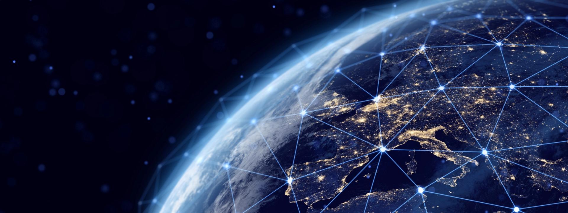Illustration of Earth from space at night, city lights connected by a glowing network of lines representing global satellite connectivity