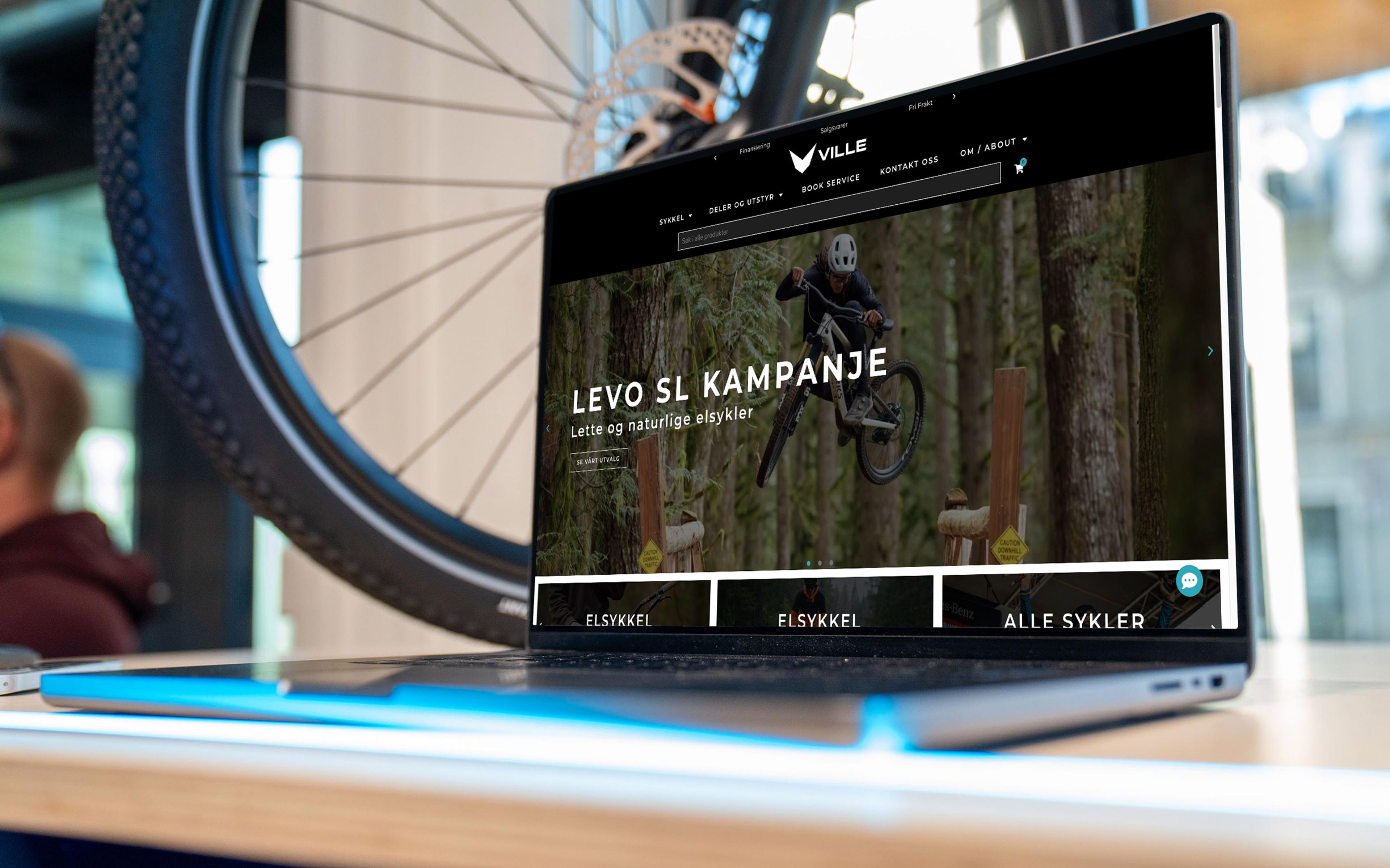Bilde av en laptop som viser villesykler.no