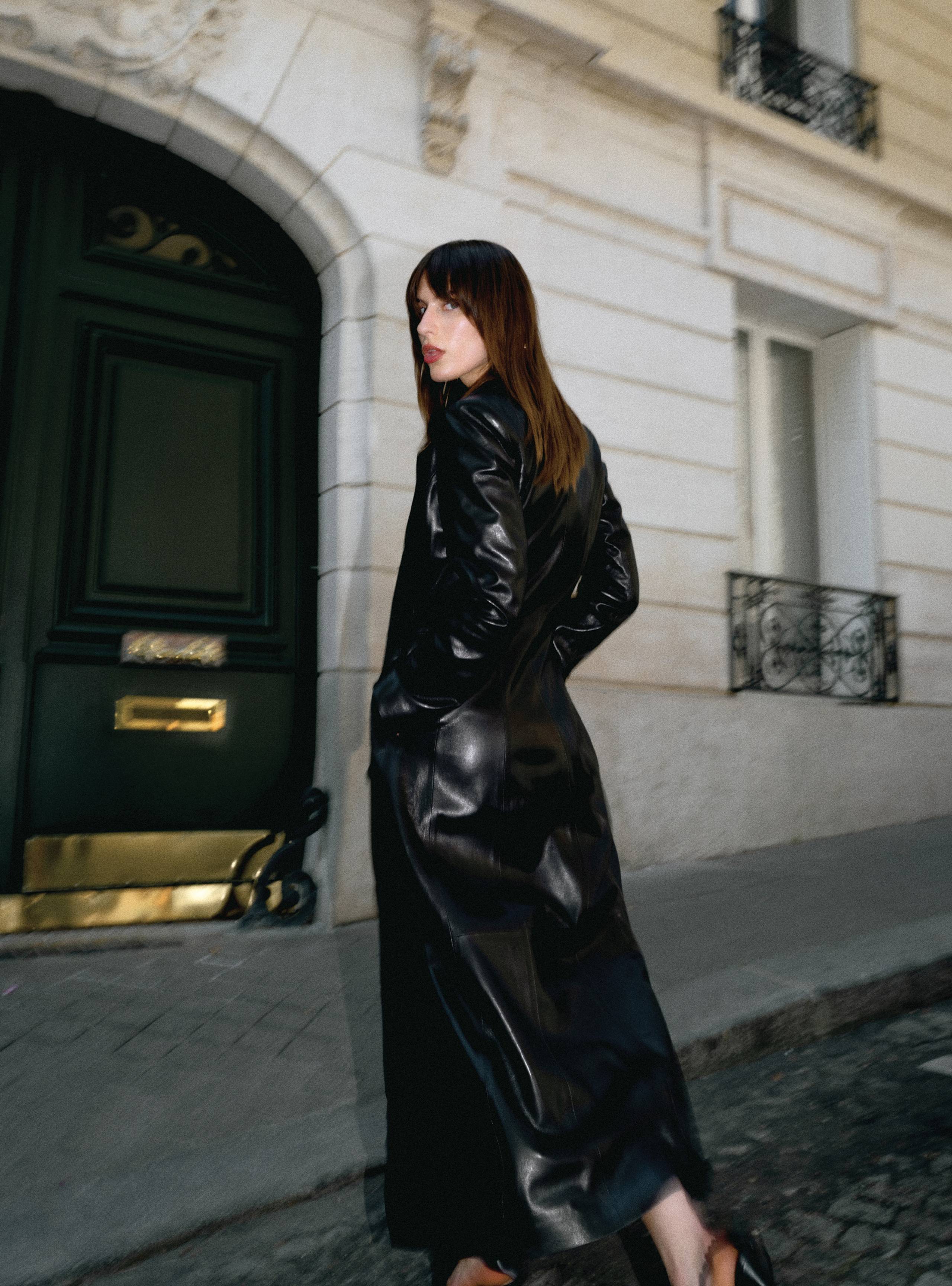 A model looking back wearing the Tamara Black leather coat