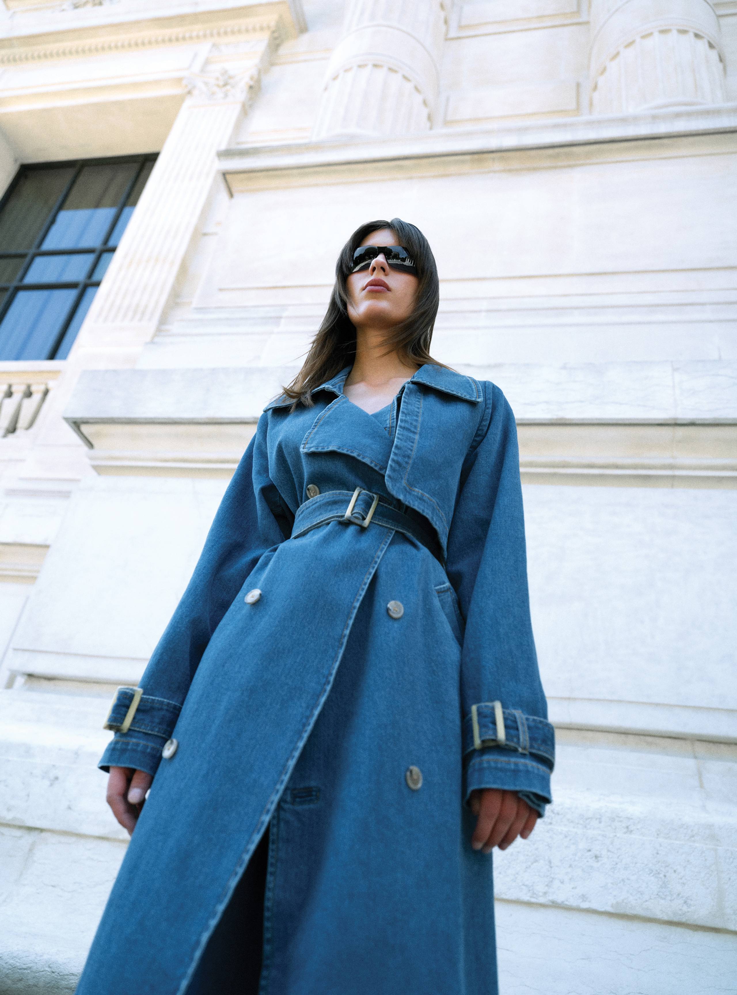 A model standing straight wearing the Harriet Denim Blue Denim coat