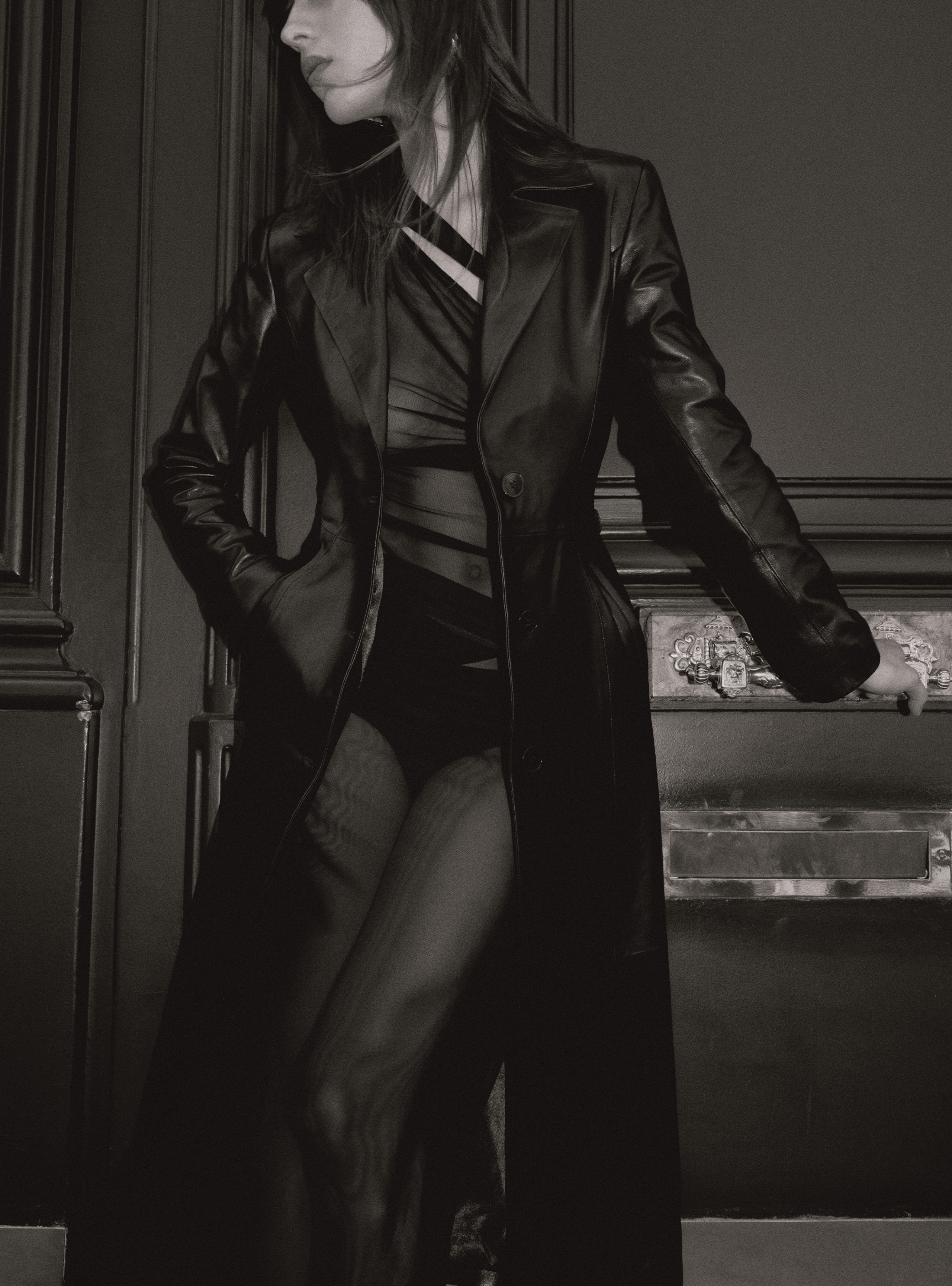 A model looking to the side in the Tamara Black leather coat