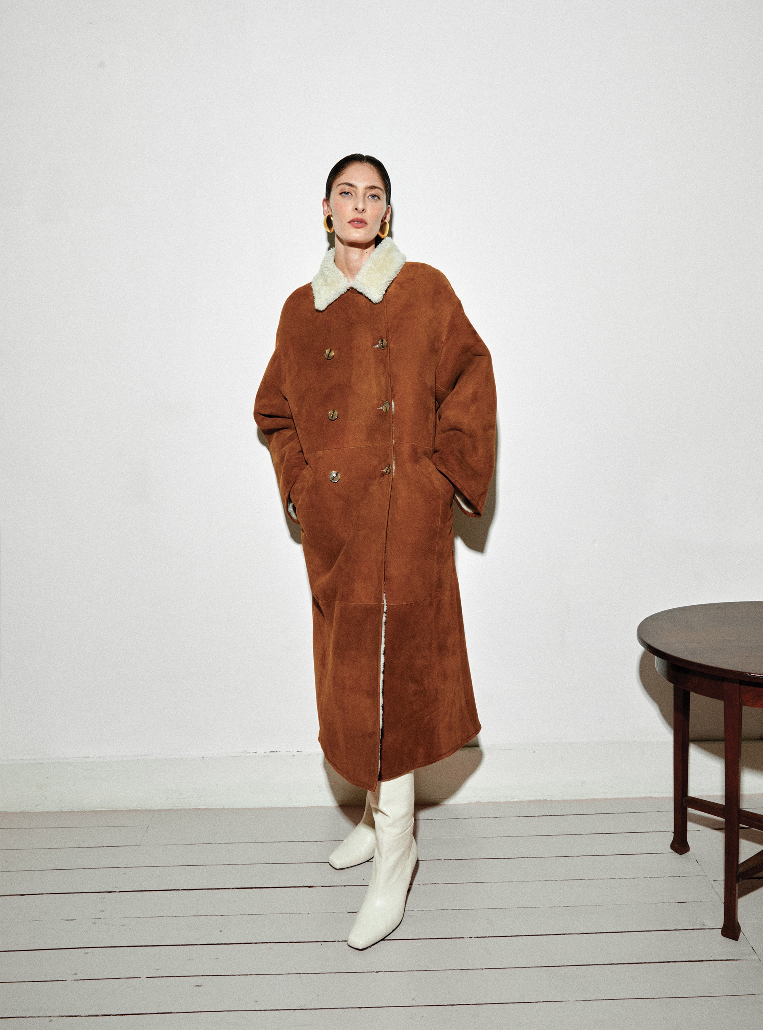 A model wearing the Noisette Double Brested shearling coat