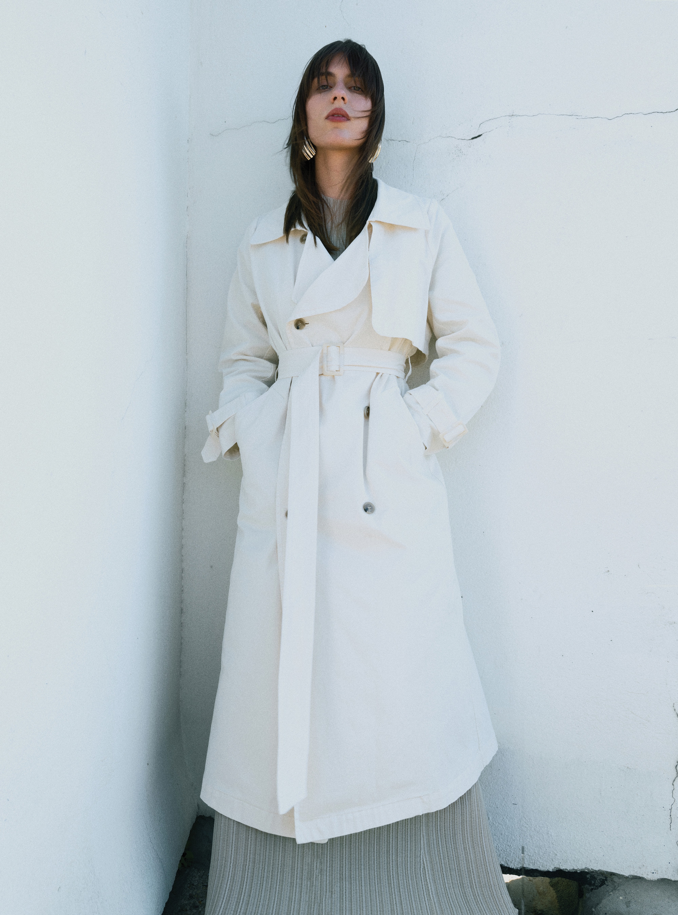 A model standing straight wearing the Harriet Canvas Cream coat