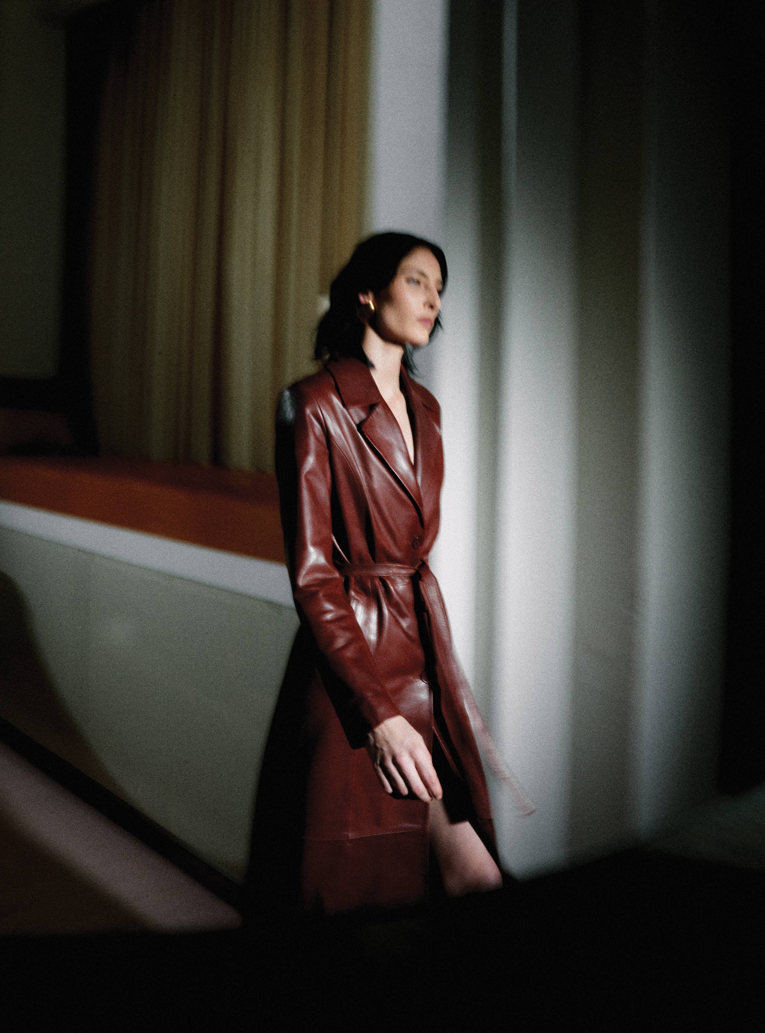 A model walking wearing the Tamara Dark Cherry leather coat