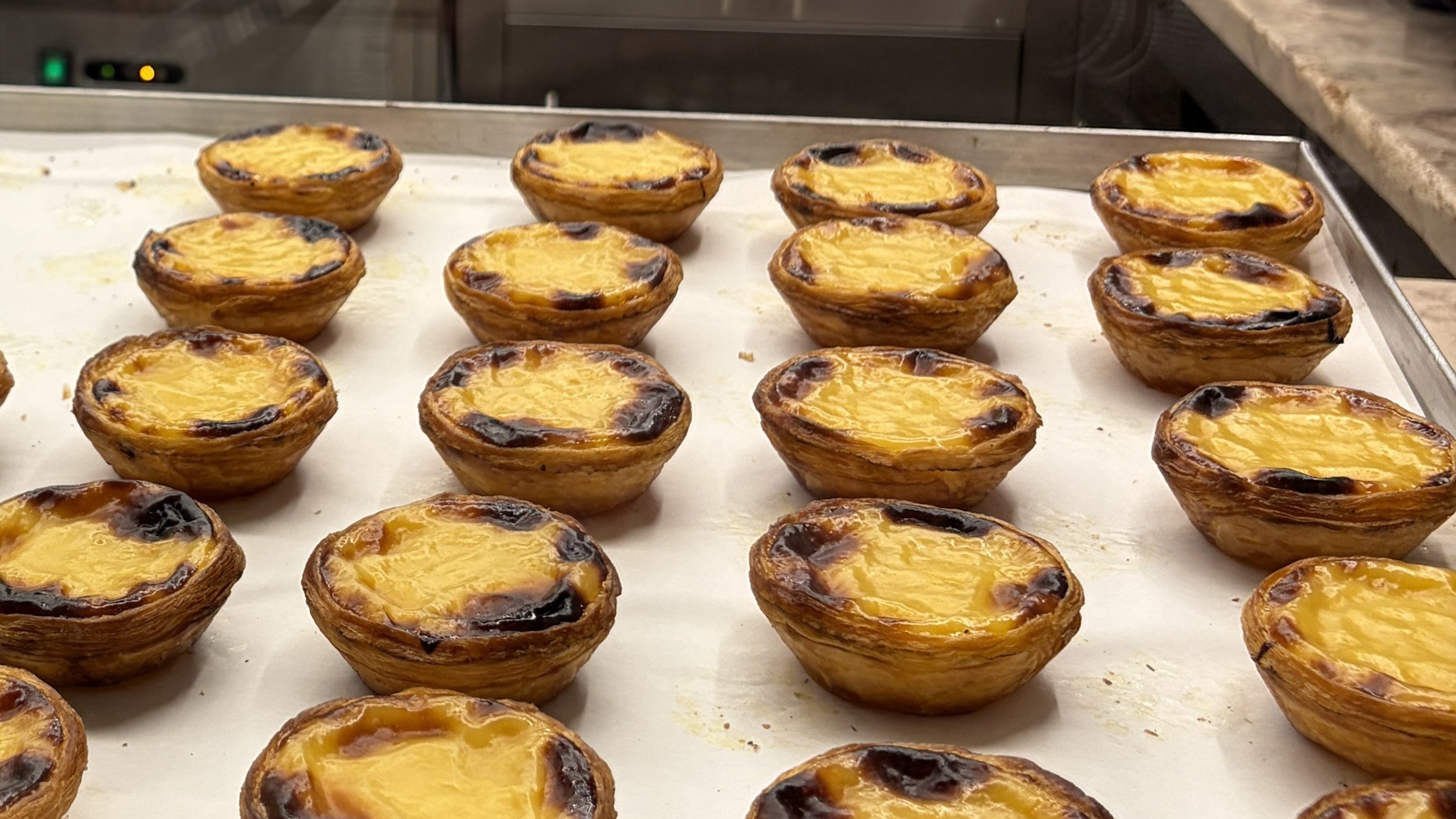 Picture of fresh pastel de nata from Lisbon in a tray