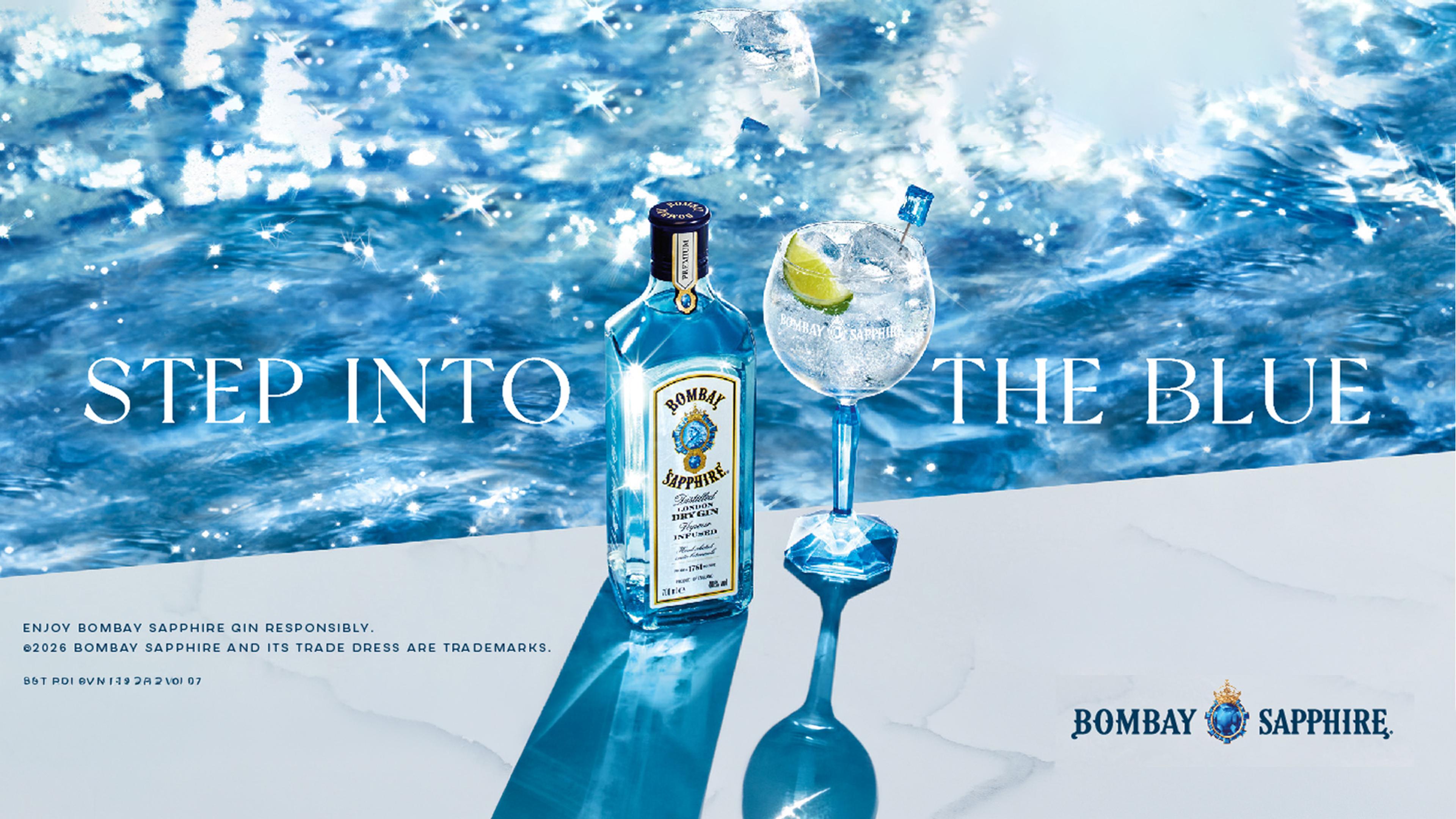 a bottle of bombay sapphire gin is sitting next to two glasses of gin
