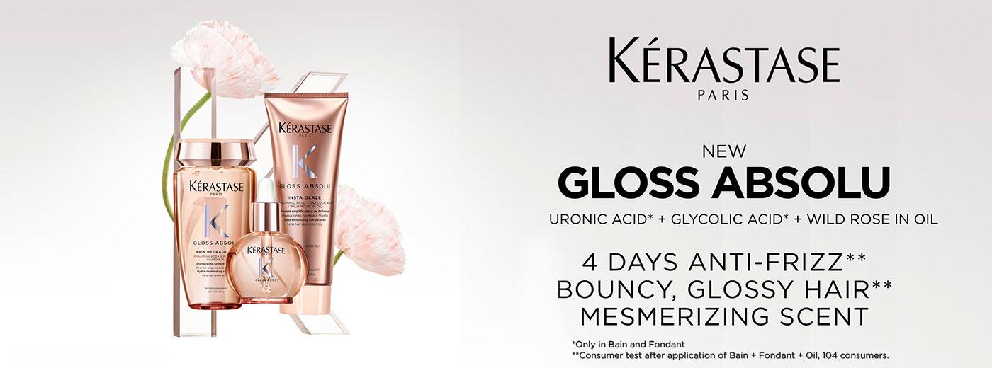 New Kerastase Gloss Absolu rose gold hair products (shampoo, oil, conditioner) with text promoting anti-frizz and glossy hair.