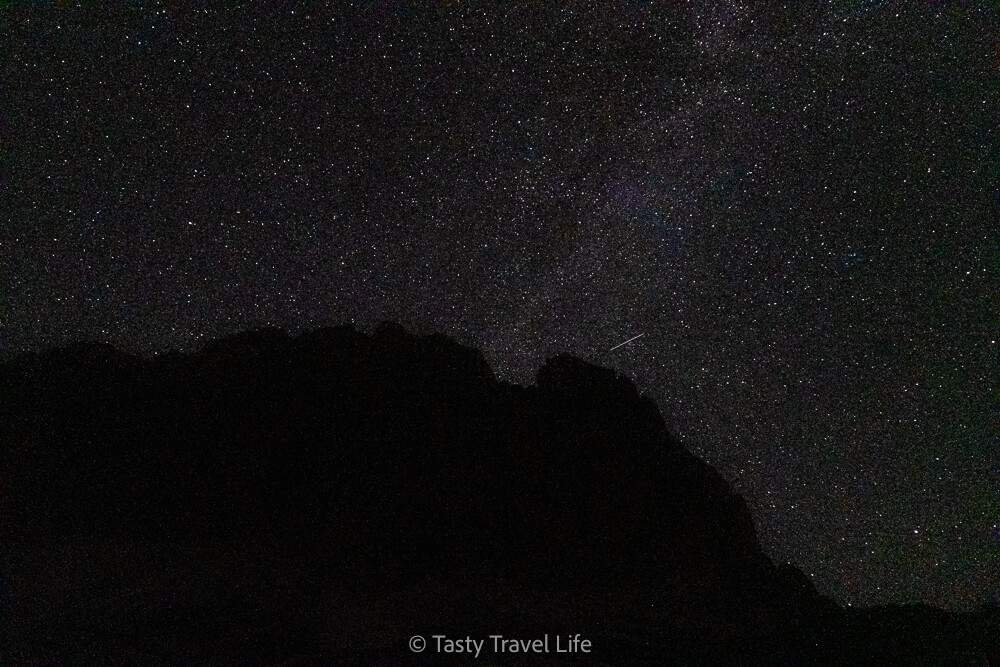 Dark sky with stars and mountain at the Rifugio Auronzo overnight parking