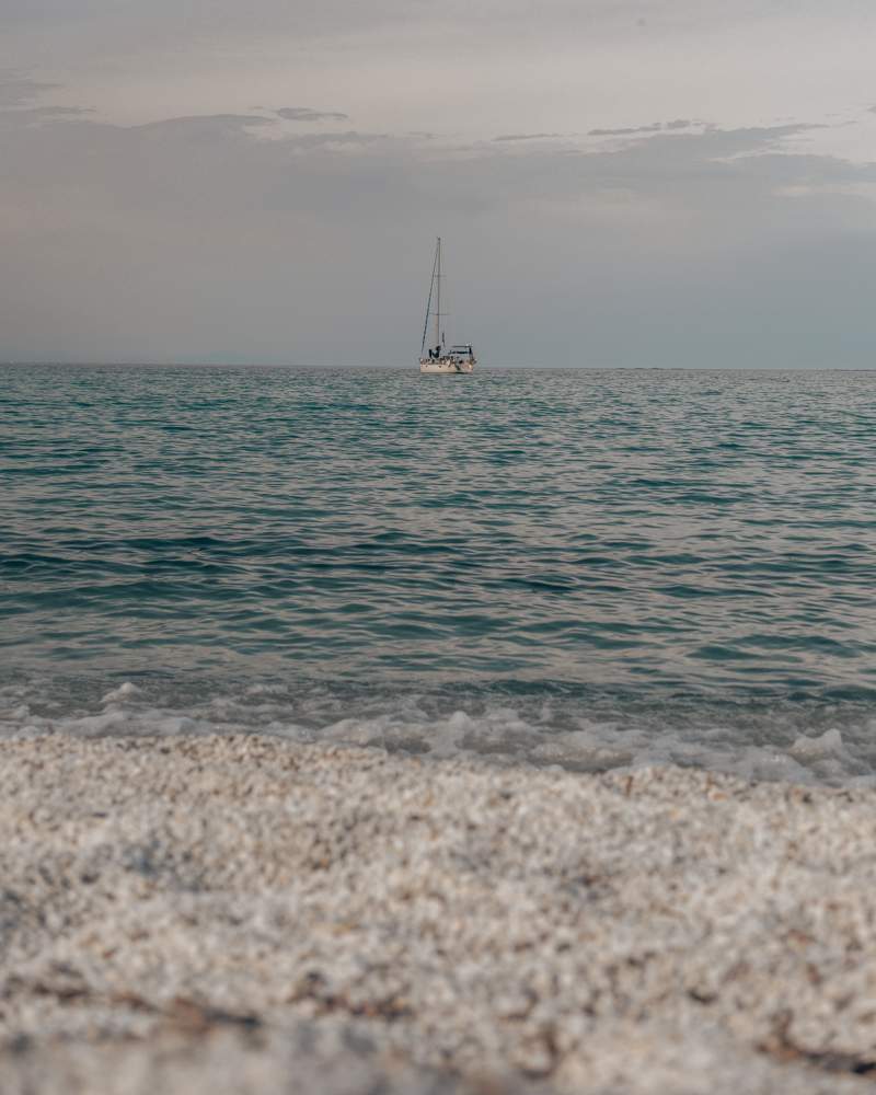 beach spot with sailor in sea. 