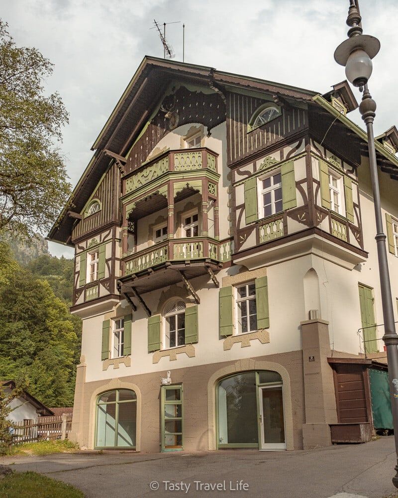 House with bavarian wooden details in light green 