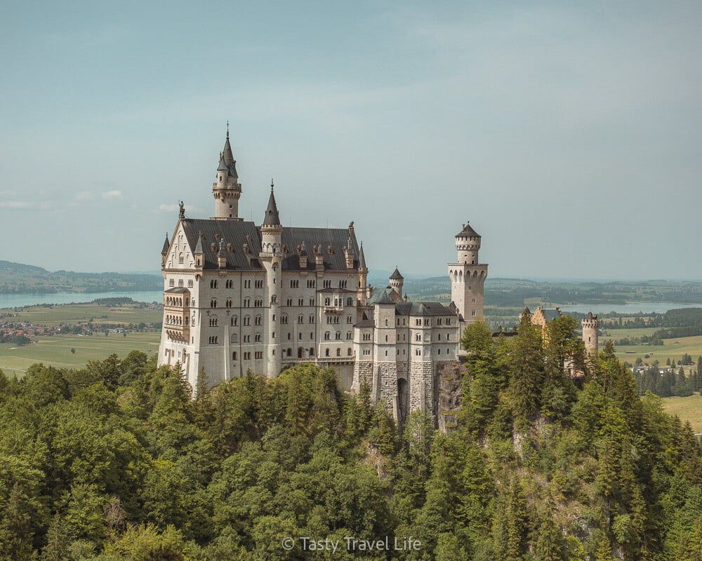 Neuschwanstein castle on a hill top.