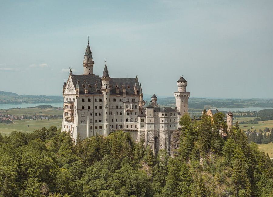 Neuschwanstein castle on a hill top.