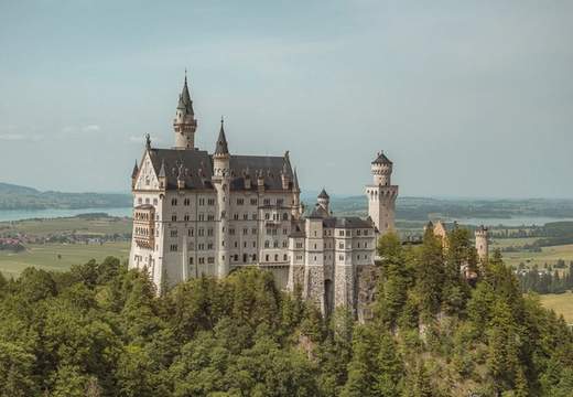 Neuschwanstein castle on a hill top.