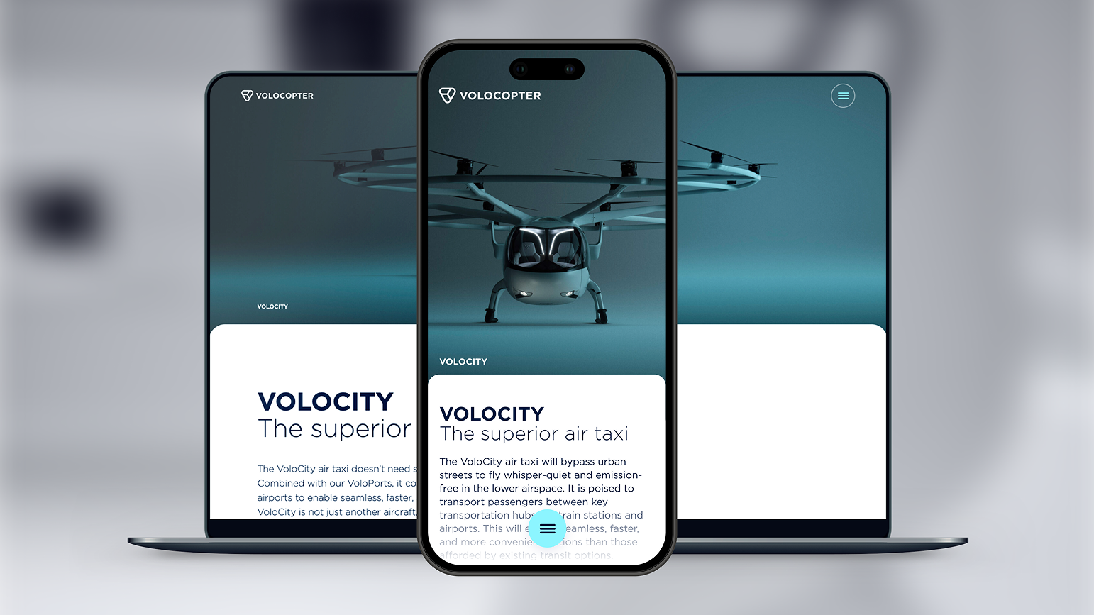 Volocopter Website-Mockup auf Laptop und Smartphone: „Volocity – The superior air taxi" auf monochromen Hintergrund mit Flugzeug