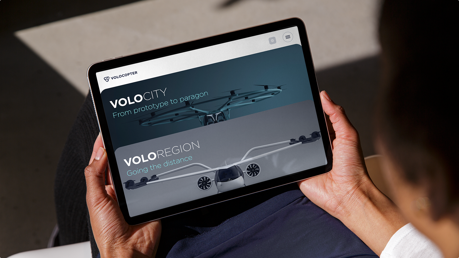 Volocopter Website auf Tablet: Produktseiten „Volocity – From prototype to paragon" und „Voloregion – Going the distance"