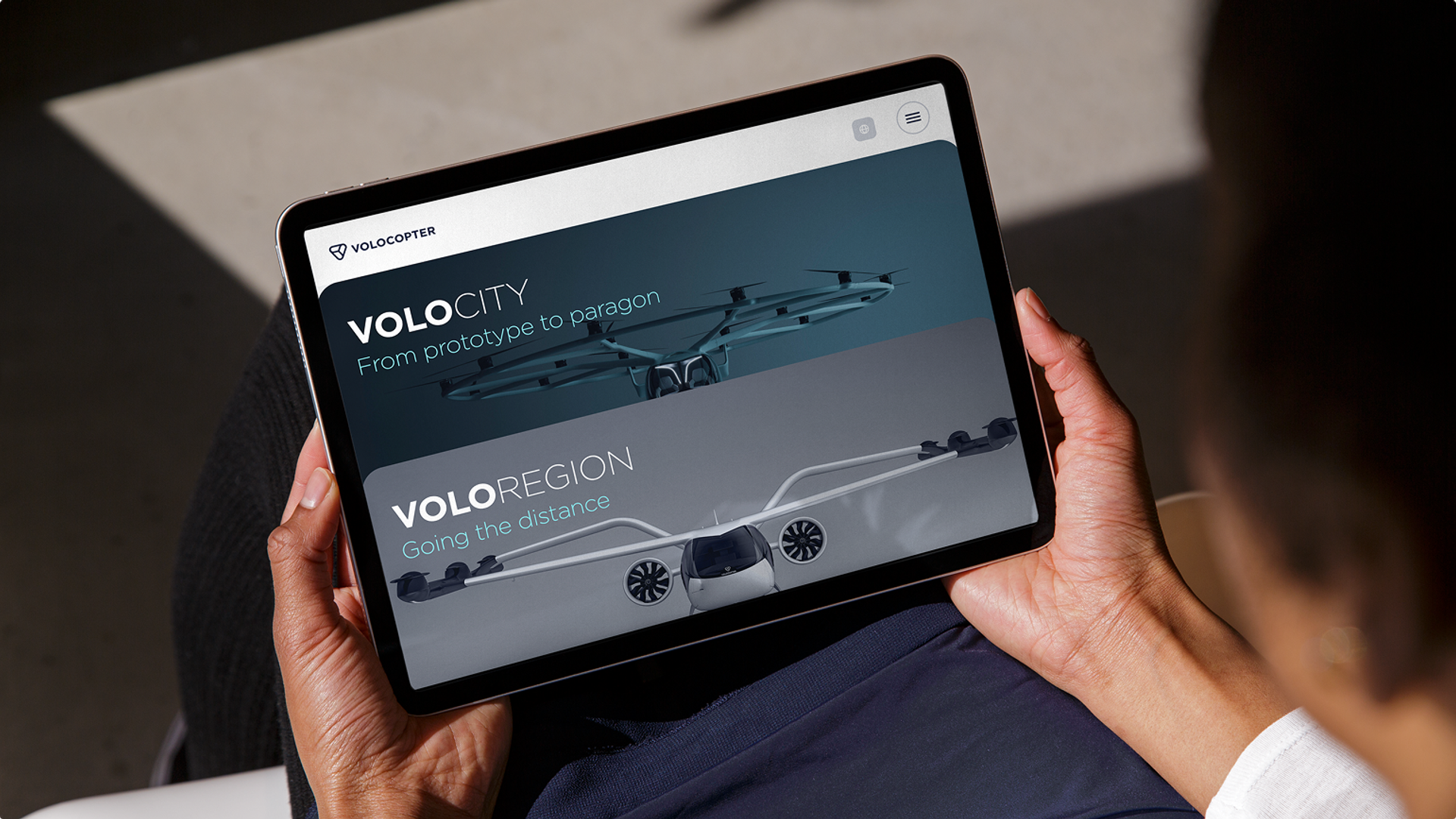 Volocopter Website auf Tablet: Produktseiten „Volocity – From prototype to paragon" und „Voloregion – Going the distance"
