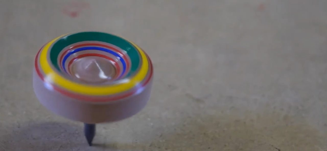 spinning wooden colorful tops