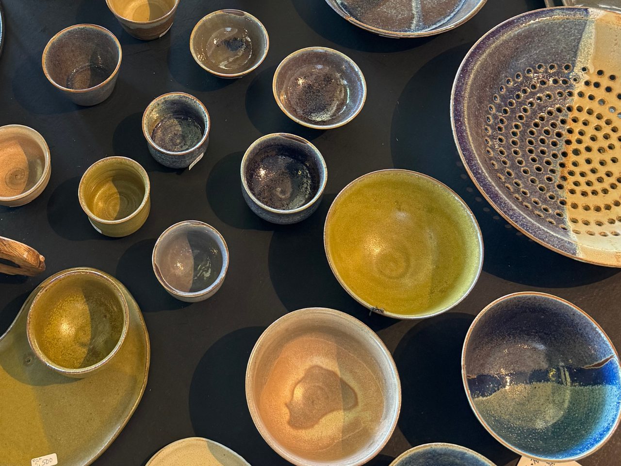Japanese pottery on a black table 