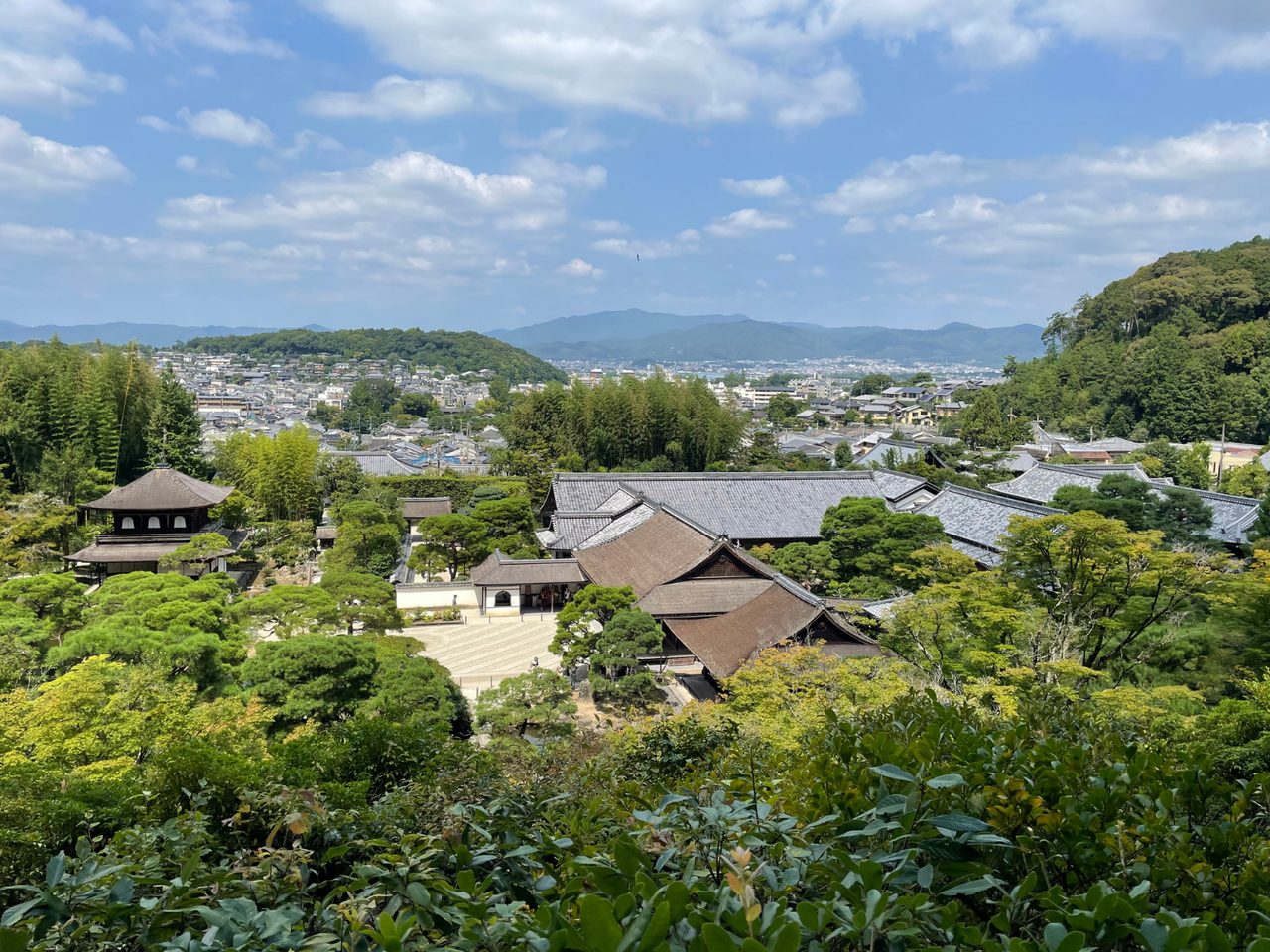 A view of Japan with lots of trees and temples