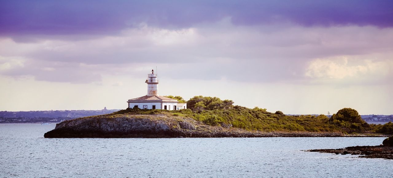Alcanada Lighthouse at Sunset, Spain.