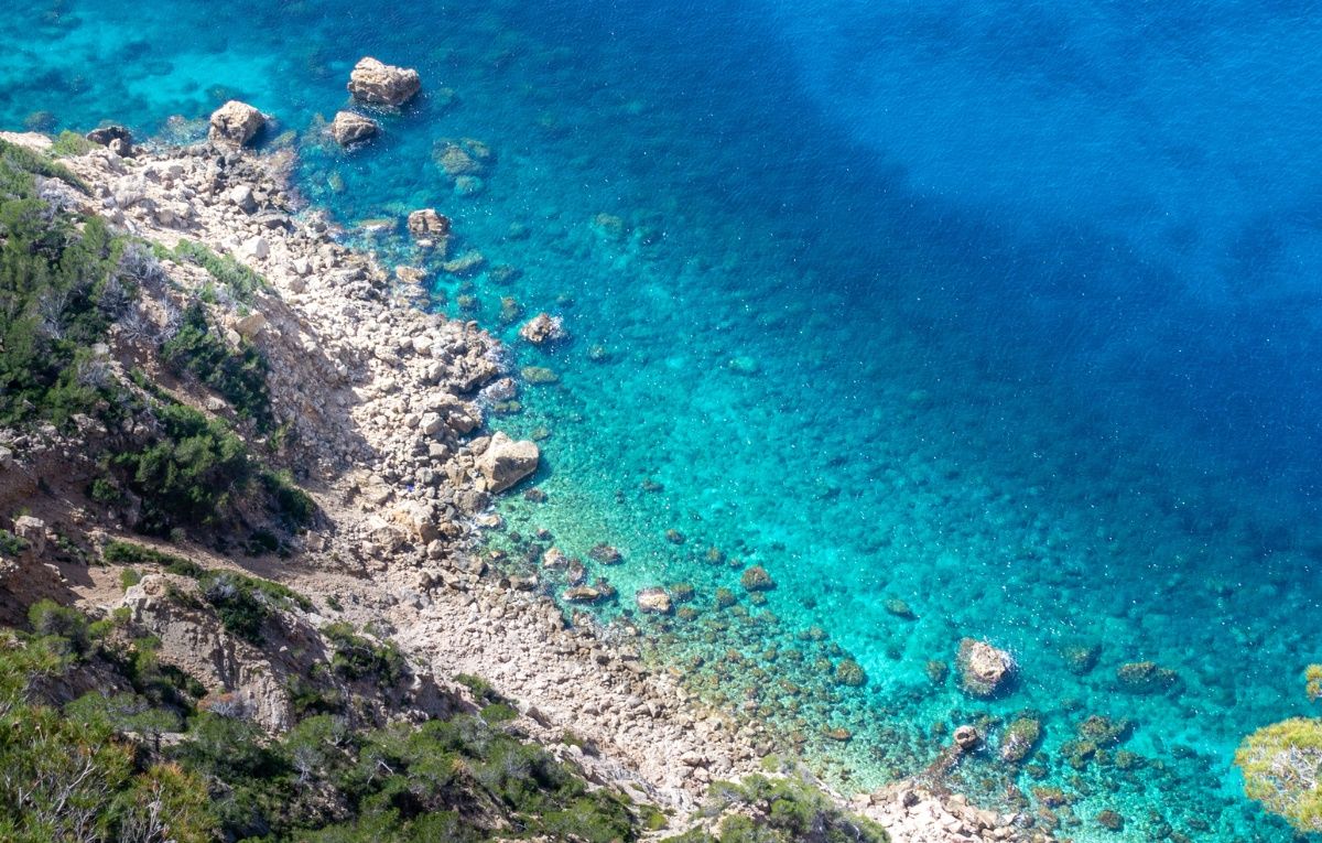 Body of Water Near Rocky Cliff, Sant Elm