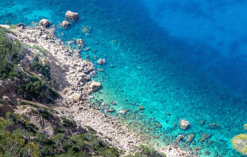 Body of Water Near Rocky Cliff, Sant Elm