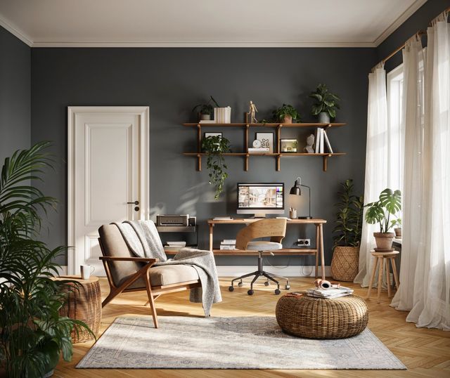 A home office with a wood-frame lounge chair, a wicker pouf and a desk under open shelves