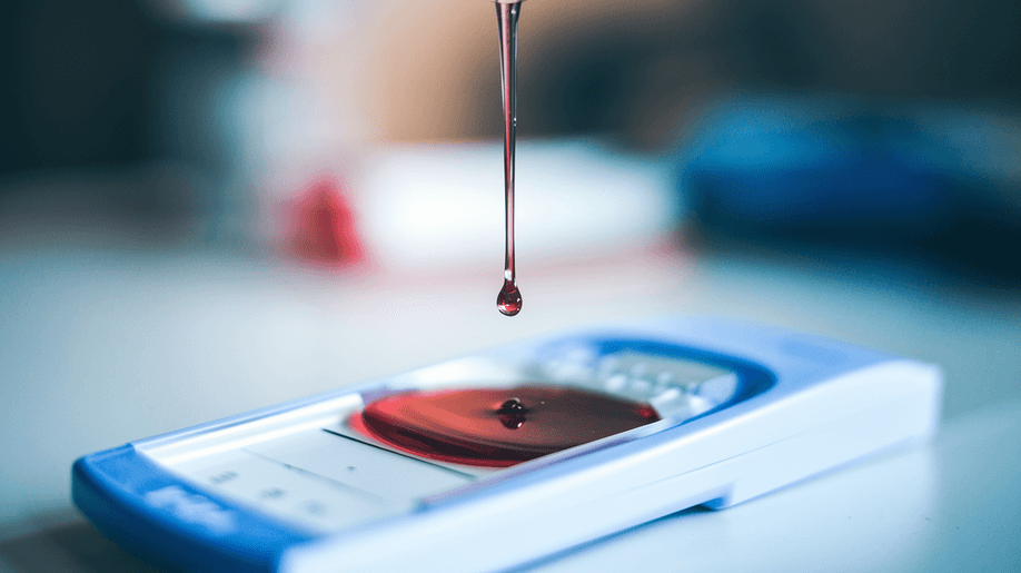 A drop of liquid falls onto a rapid self-test cassette