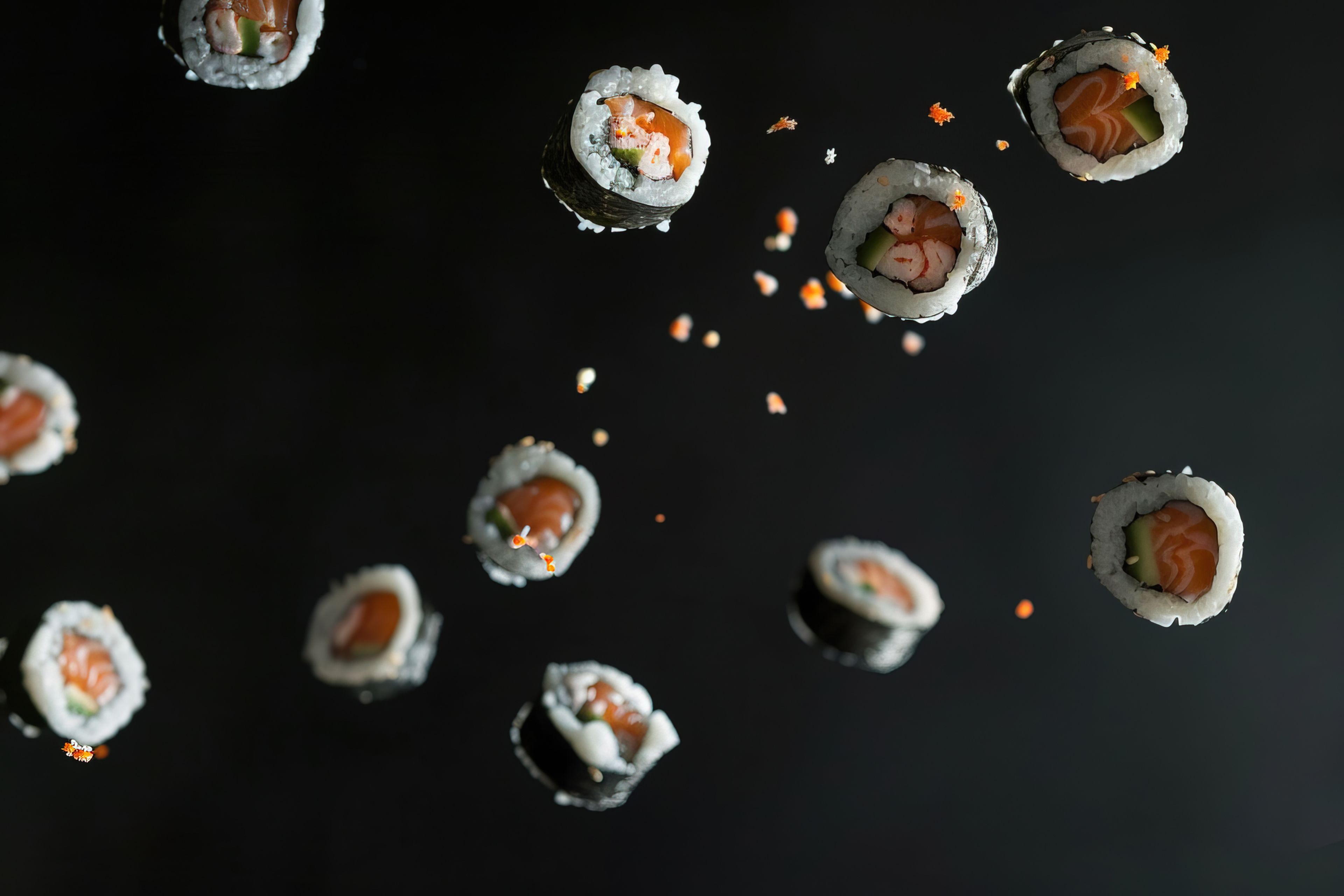 Seafood sushi dish with details and simple black background.
