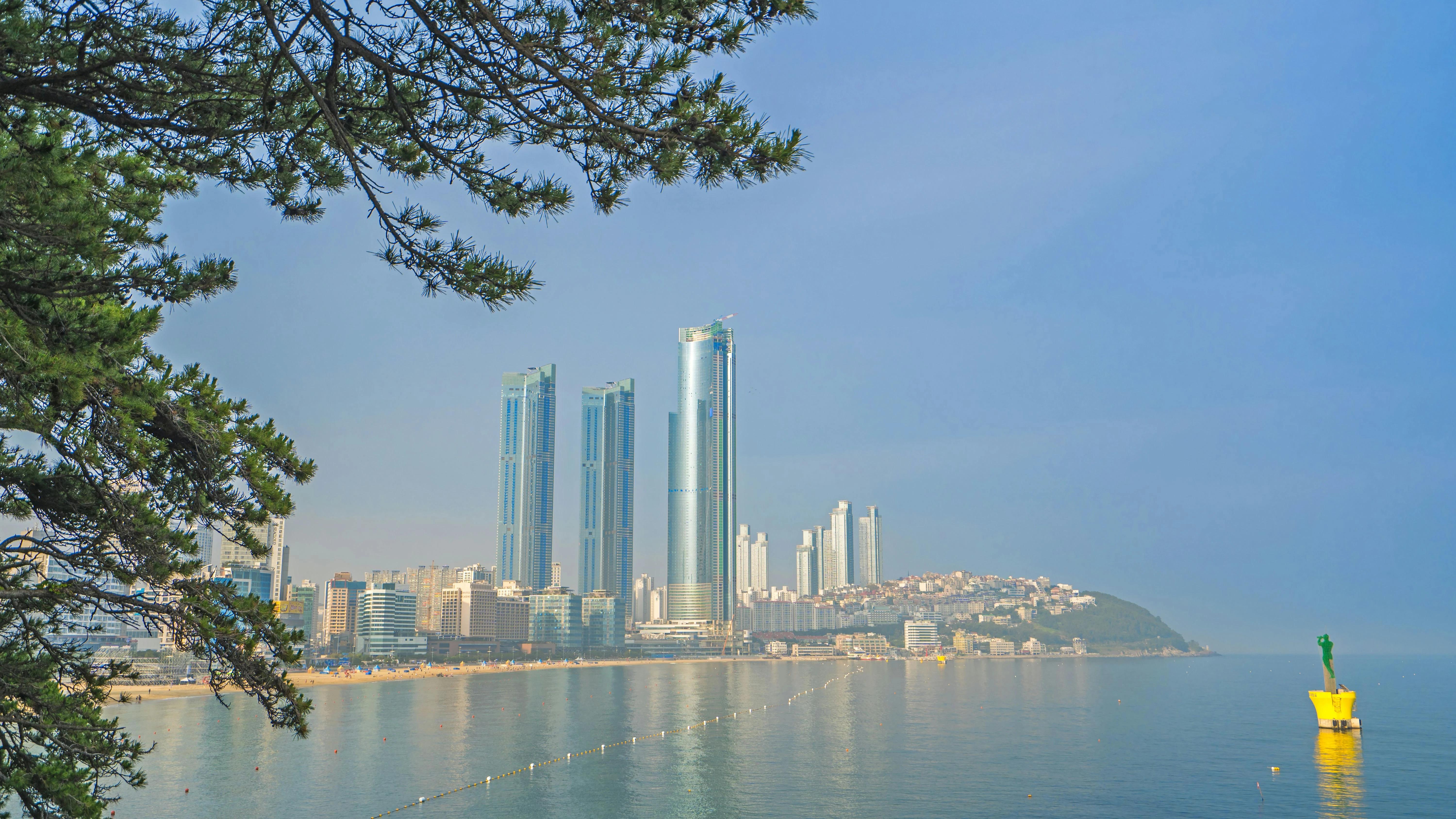 Haeundae Beach skyline in Busan, South Korea, with high-rise buildings along the coastline on a clear day