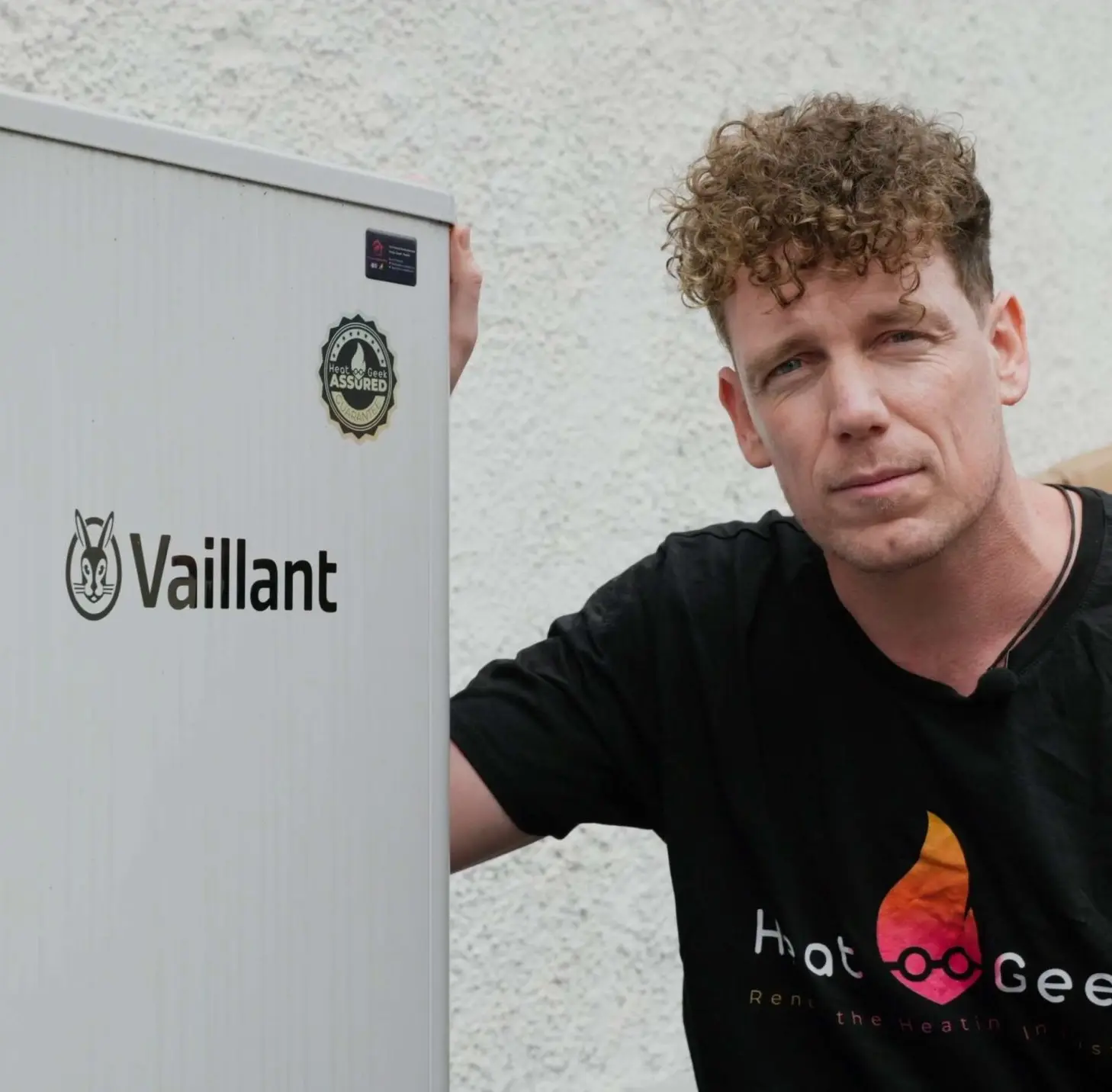 Heat geek founder next to a heat pump