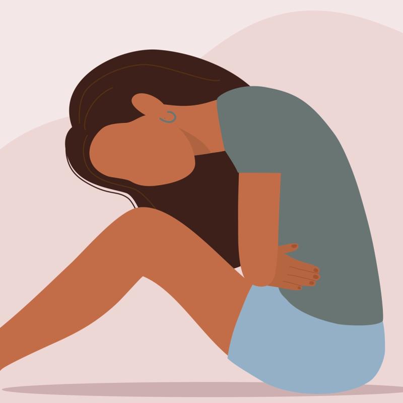 Illustration of a women sitting in pain with hands holding stomach
