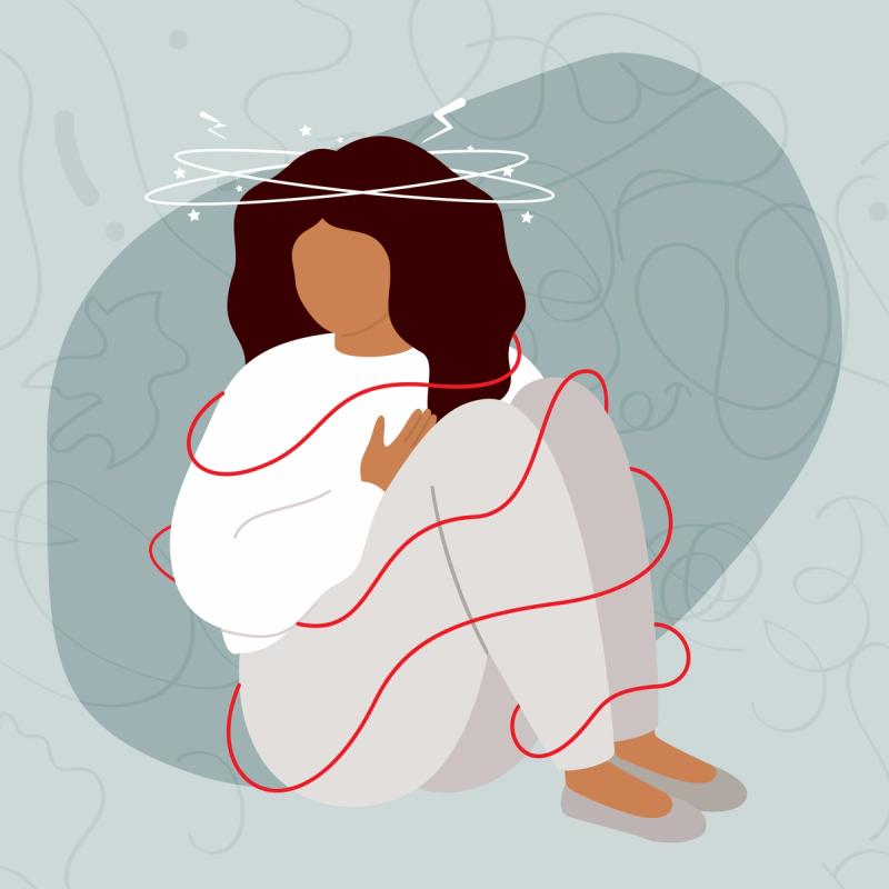 An illustration of a person, with a dejected body posture, sitting with swirls around their head and body to visualize the feeling of a panic attack.