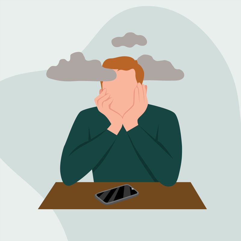Man Sitting with Chin in Hands, Clouds Surrounding His Head