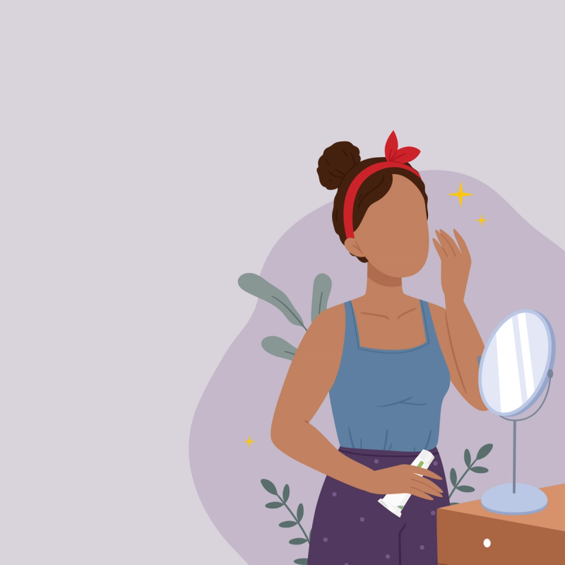 Woman smiling and cleaning her face