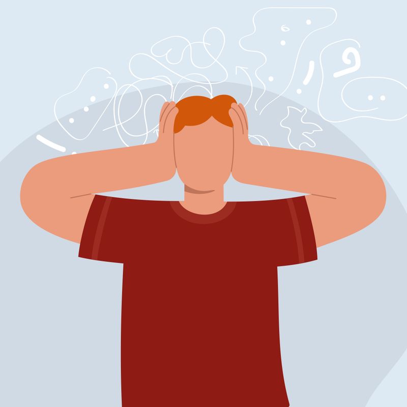Illustration of a man holding his head and experiencing anxiety