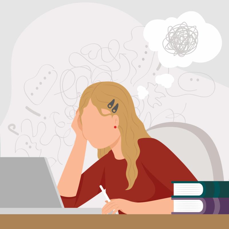 Women struggling to focus while studying on computer.