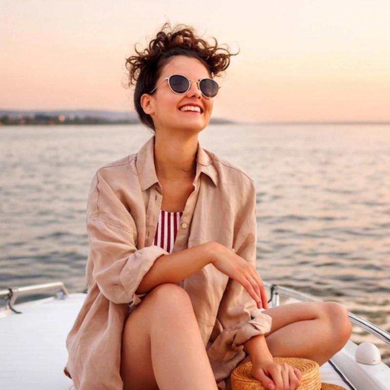 Happy woman smiling on a boat