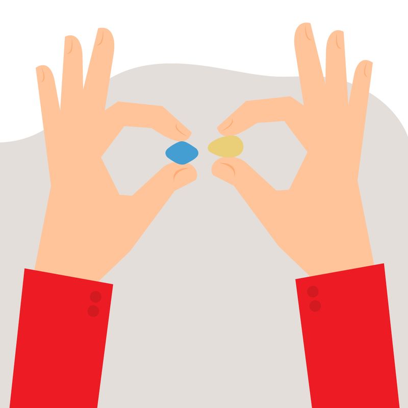 Illustration of Hands Holding ED Medications