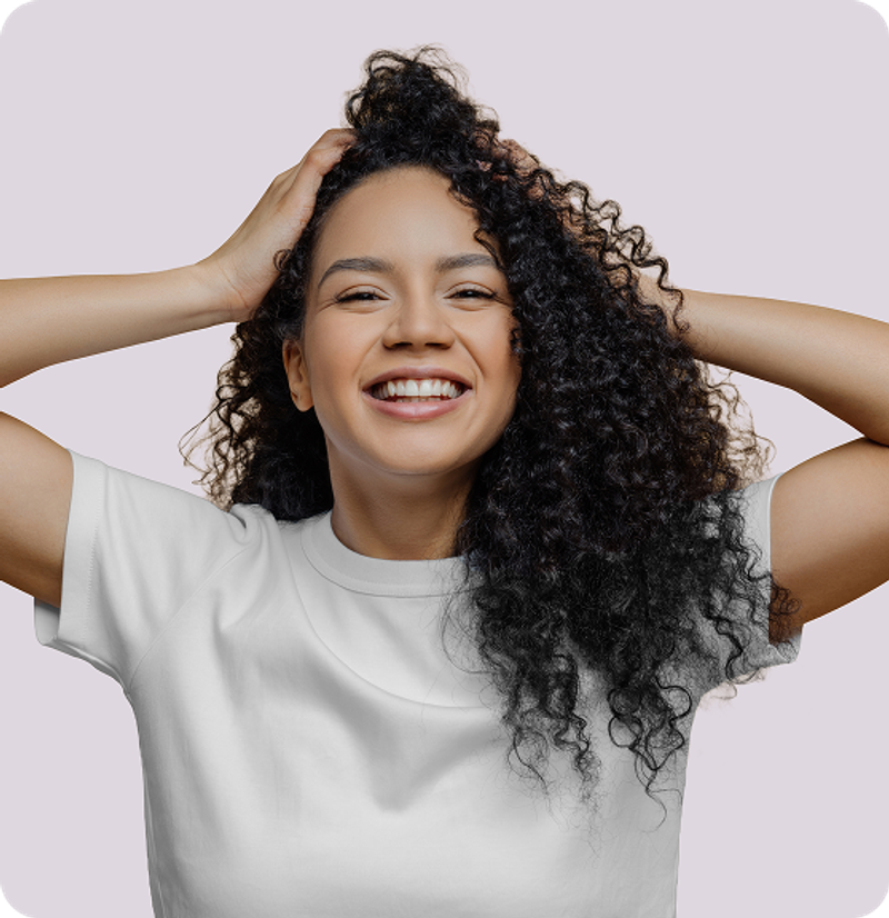 An illustration of a woman holding a brush filled with strands of hair.