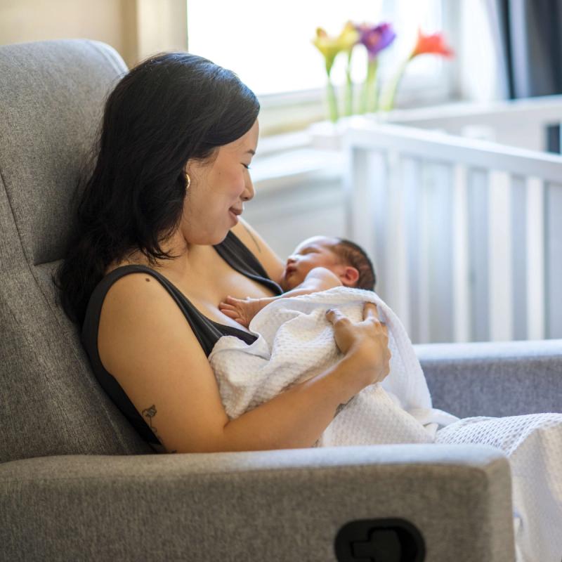 Woman Holding Baby in Recliner