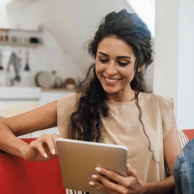 Image of Woman Scrolling On Tablet