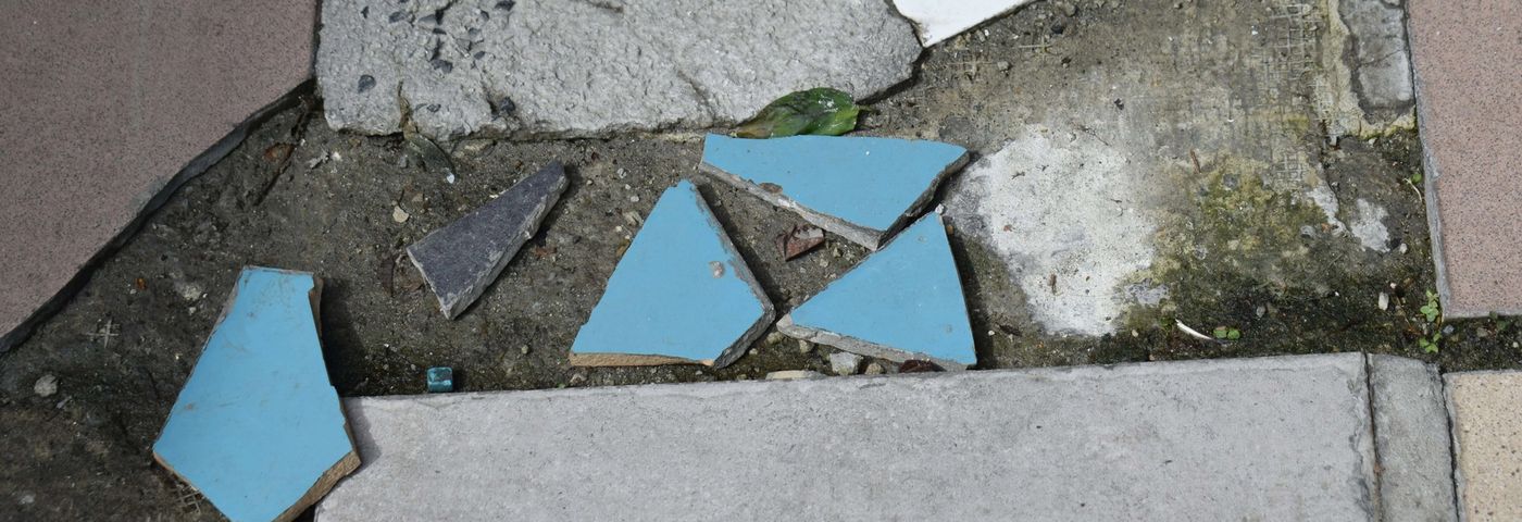 Cracked floor tile being removed for repair in a Dubai villa