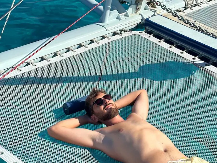 Sunbathing on the bow of Na Maka