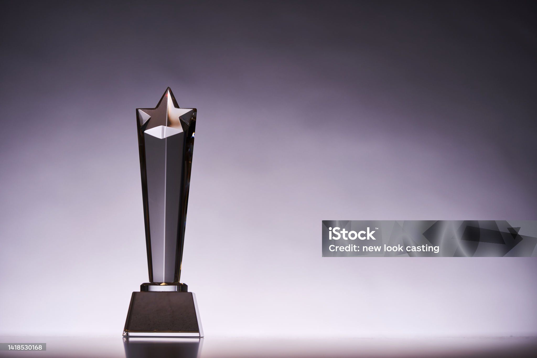 An award with a glass star atop