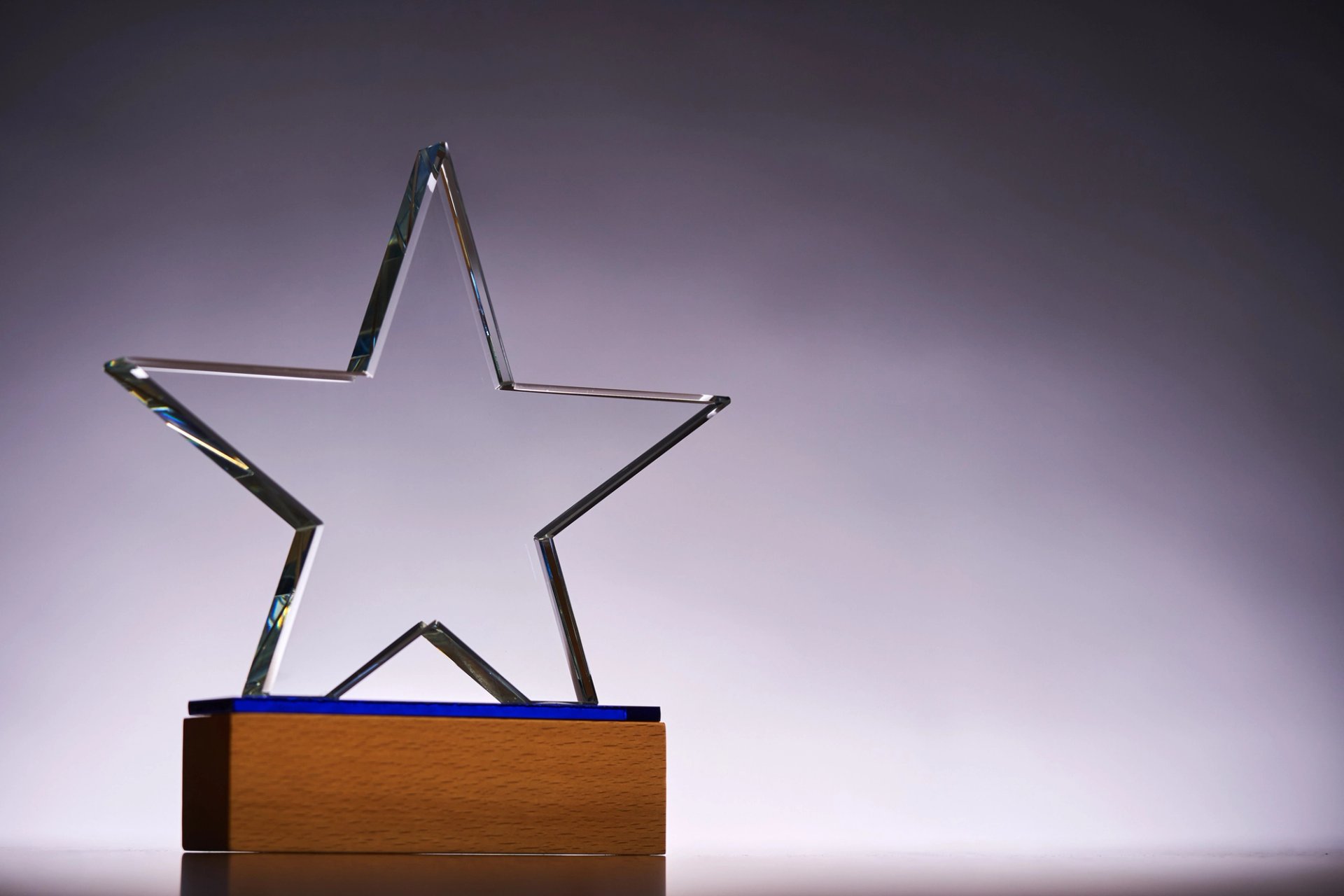 An award with a glass star atop