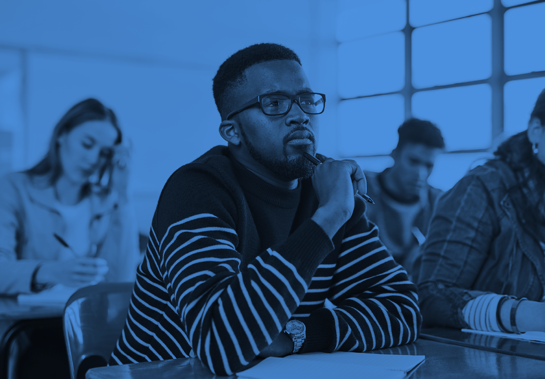Young man sitting in a classroom