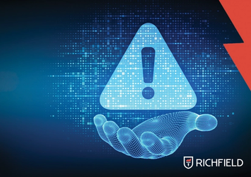 Digital hand holding a warning sign with the Richfield logo in the bottom right corner.